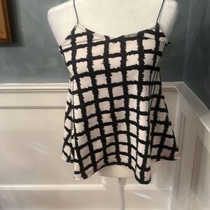 Glamorous sleeveless  top perfect for office/nighttime wear . Size Small.